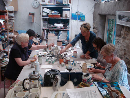 Sara Roberts giving a ceramics workshop